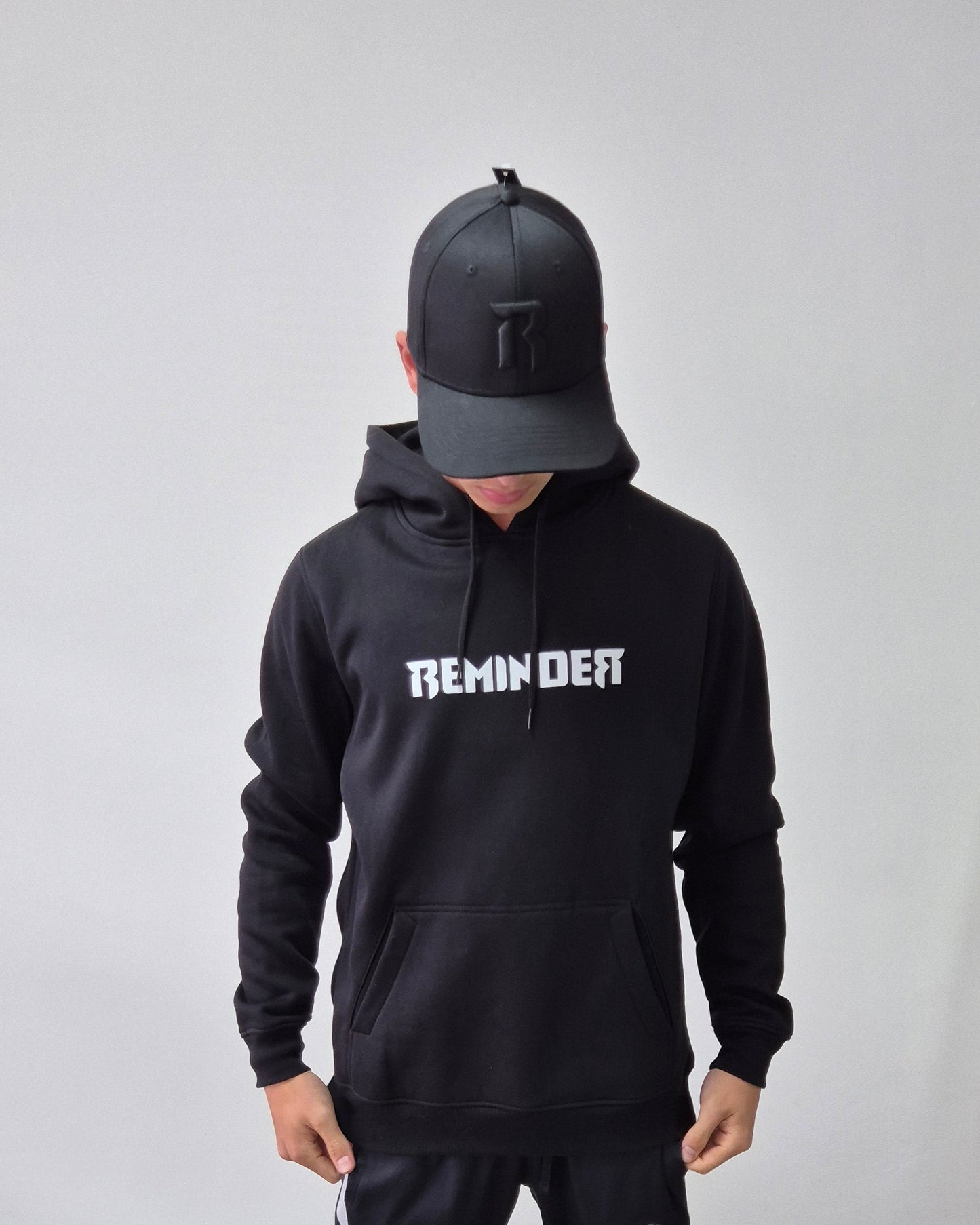 reminder hoodie witte logo tekst
